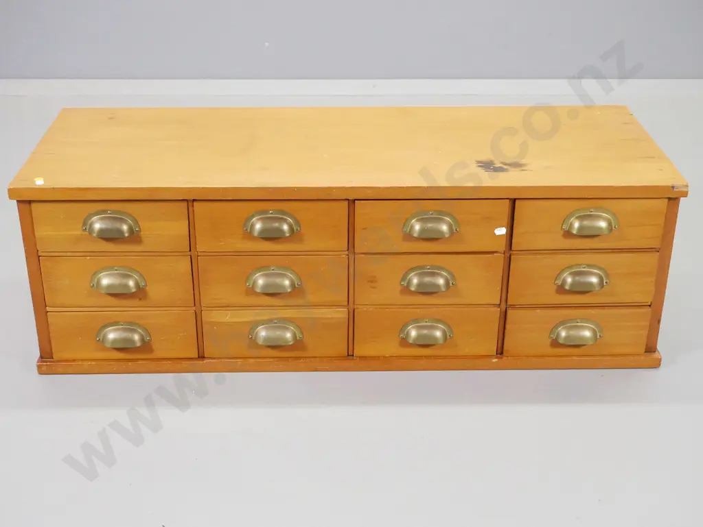 vintage kauri cabinet of 12 office drawers with brass cup handles - cracks, chip to top H330 W1050 D410 Image 1++