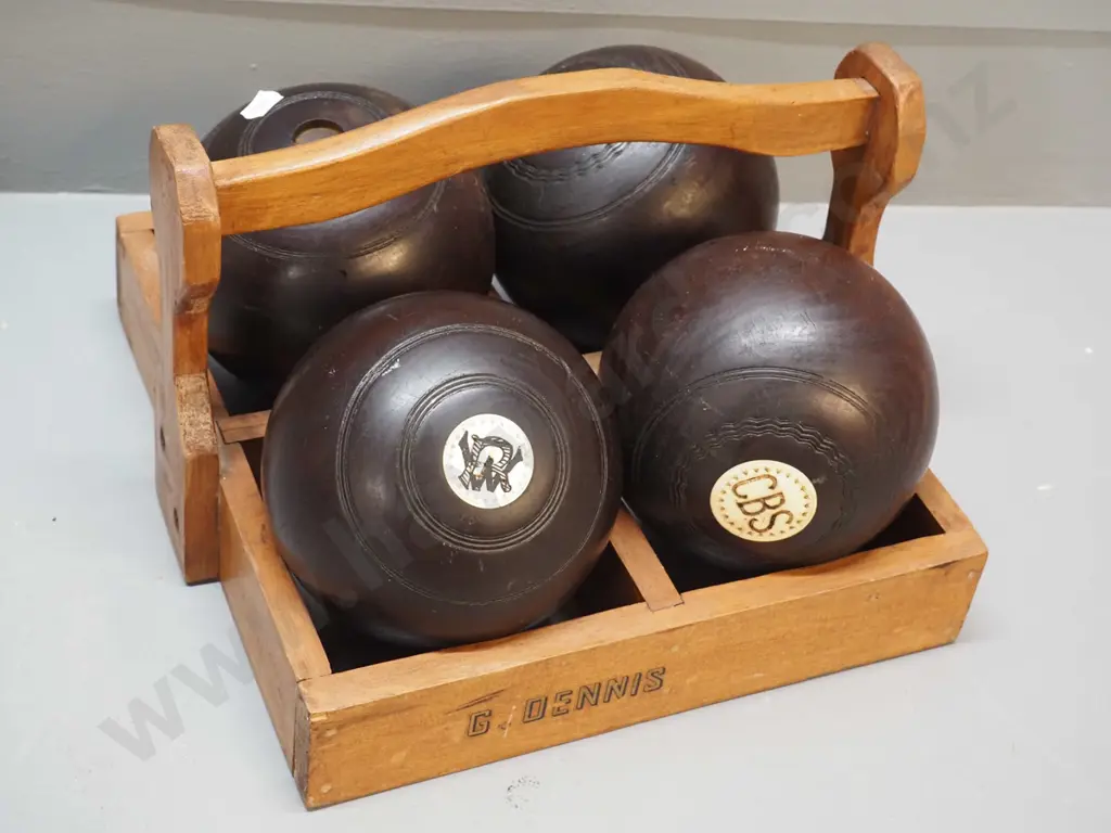 4 lawn bowls with bone insets, in wooden carrier - one is missing one inset Image 1++