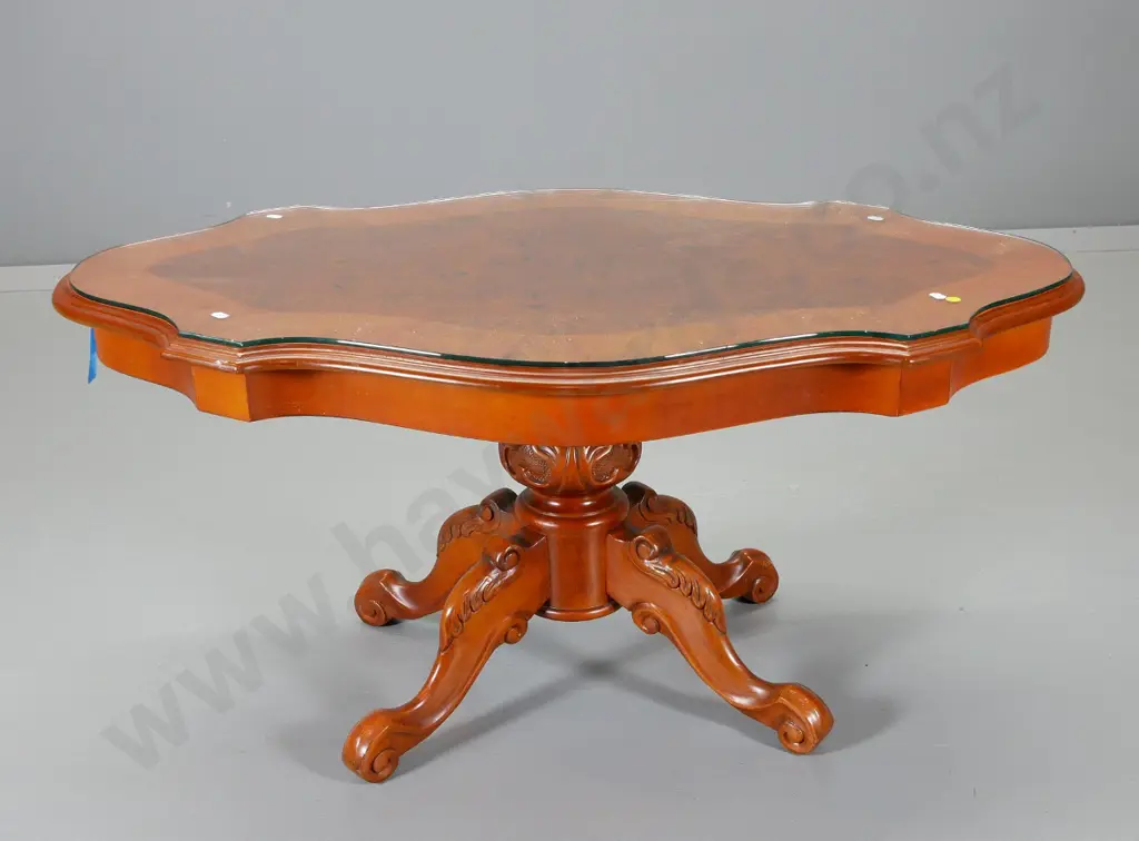 reproduction coffee table with burr walnut veneer scallop edge top, carved pedestal base, glass on top H490 L1030 W620 Image 1++