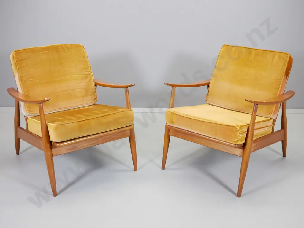 pair of mid-century mahogany framed lounge chairs with loose back and seat squabs in gold velvet H770 W670 D770 Image 1++
