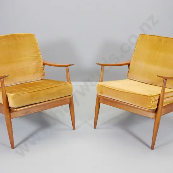 pair of mid-century mahogany framed lounge chairs with loose back and seat squabs in gold velvet H770 W670 D770