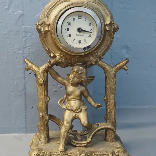 ornate cherub motif cast metal gilt finish mantel clock - Mercedes movement H-300 W-170 D-120