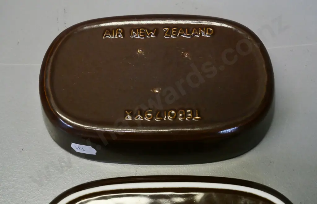 two Air New Zealand pie dishes - one has faded logo, other marked "Inflight Top" Japan L-175 W-105 Image 1++