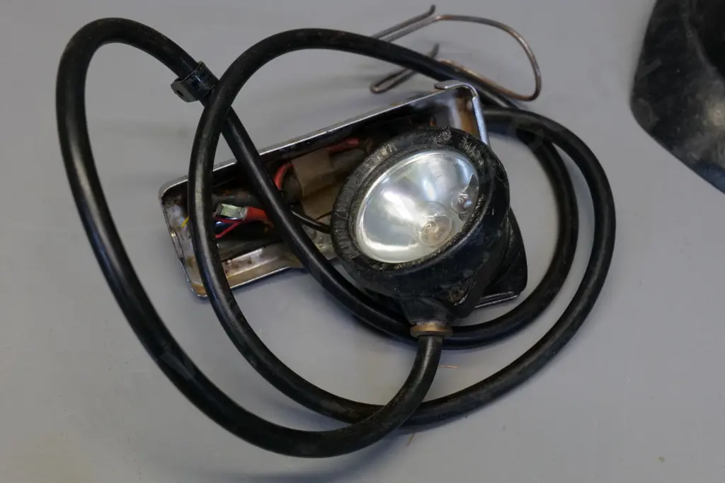 black fibre miner's helmet with lamp cord and fitting - light housing marked Oldham & Son Manchester . Wear and tear Image 1++