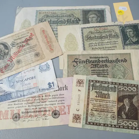 assorted bank notes - six 1920s German and one Singapore