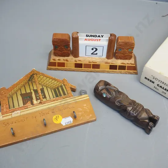 3 New Zealand souvenir items - Sovereign ware desk calendar (cards complete) small carved wooden tiki, and a key holder