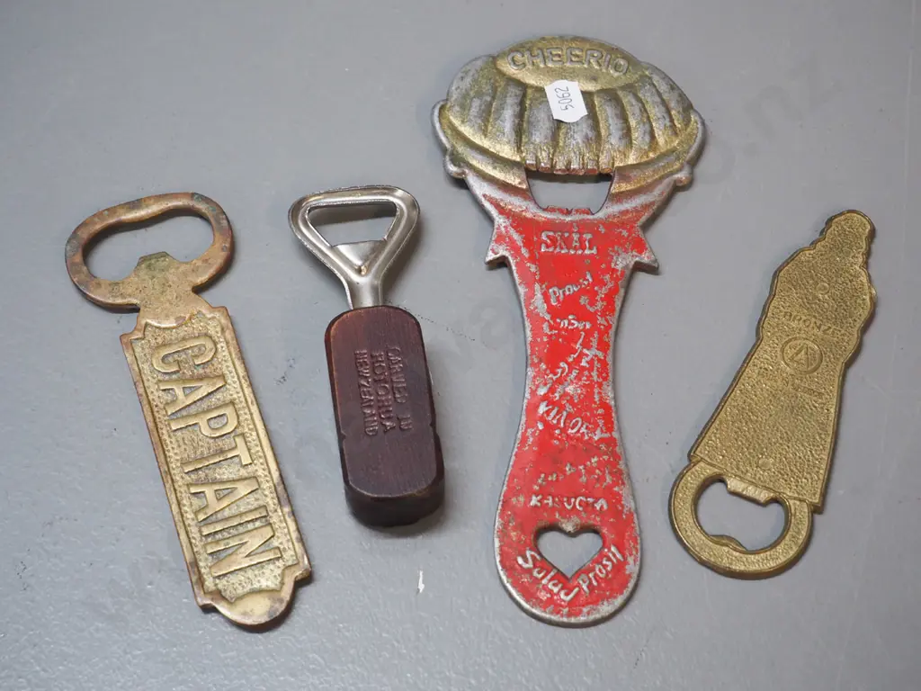 4 vintage bottle openers - large cast metal clown L-210, enamelled bronze woman from Greece, wooden Rotorua tiki etc. Image 1++