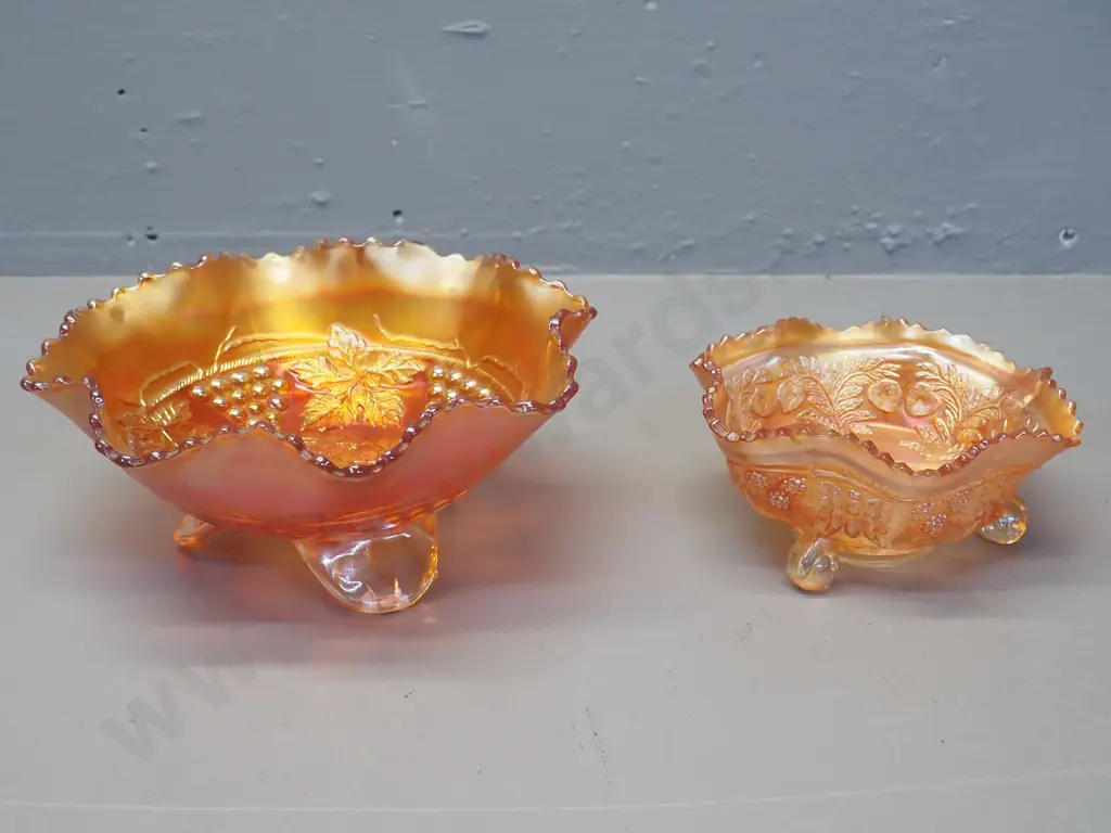 2 marigold carnival glass footed bowls - larger one grape pattern D-200, other is cat motif Image 1++