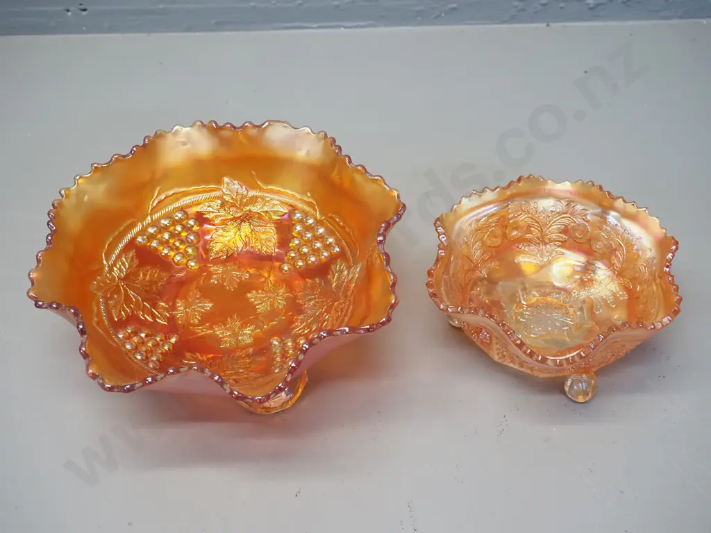 2 marigold carnival glass footed bowls - larger one grape pattern D-200, other is cat motif Image 1++
