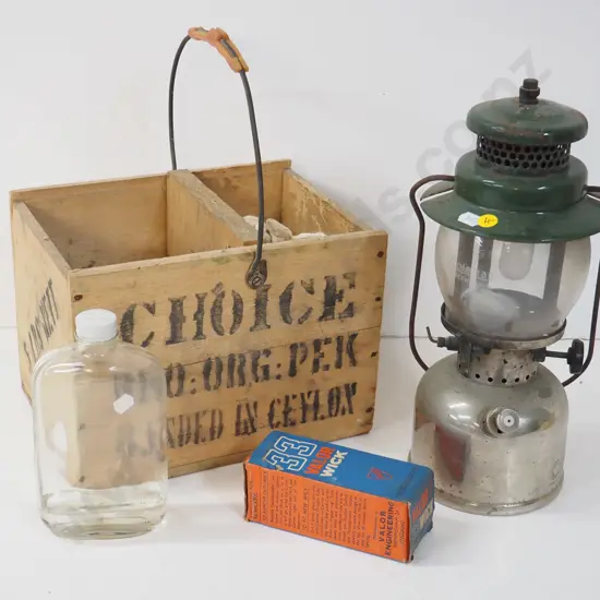 Coleman kerosene lamp H-340 with wooden box made from tea crate, spare wick, fuel bottle etc.