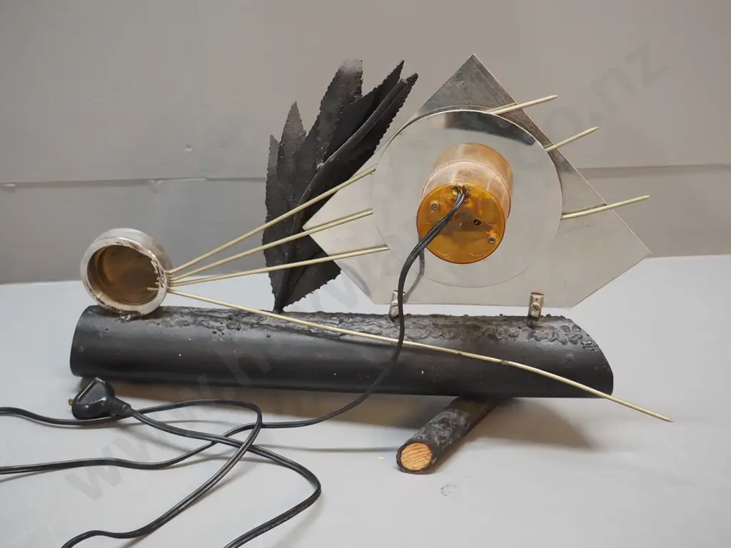 electric table / mantel clock with heavy faux log metal base, chrome face, metal leaves and sunburst H310 W440 Image 1++