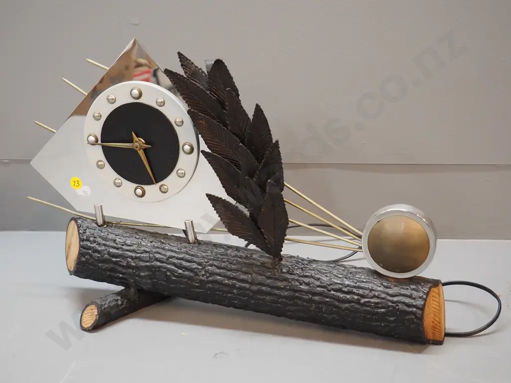 electric table / mantel clock with heavy faux log metal base, chrome face, metal leaves and sunburst H310 W440 Image 1++