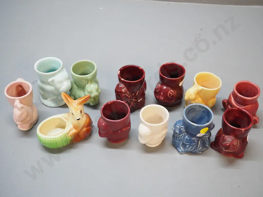 collection of 12 vintage egg cups including Crown Lynn - bulldog, rabbits, clown, squirrel, etc. Image 1++