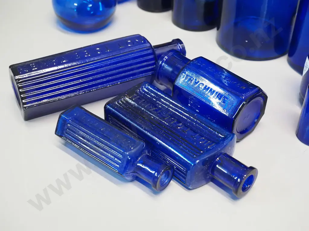 assorted blue bottles - one marked strychnine, 3 "Not to be taken"- tallest is H-270 Image 1++