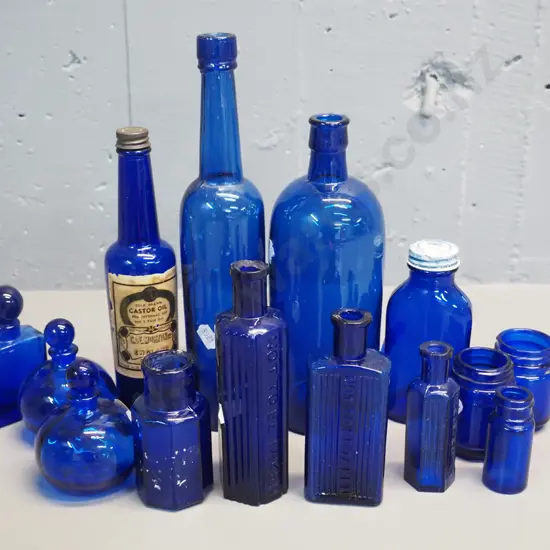 assorted blue bottles - one marked strychnine, 3 "Not to be taken"- tallest is H-270