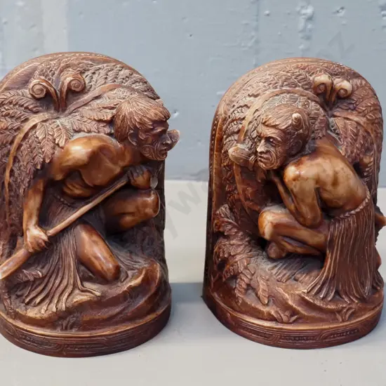 pair of composite Maori warrior book ends with  motif - several small chips & wear to finish H170