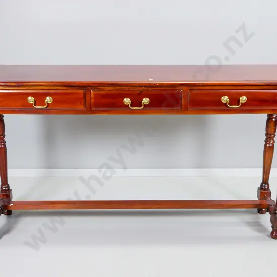reproduction mahogany hall table with 3 drawers, turned legs, stretcher base brass drop handles H800 W1460 D340