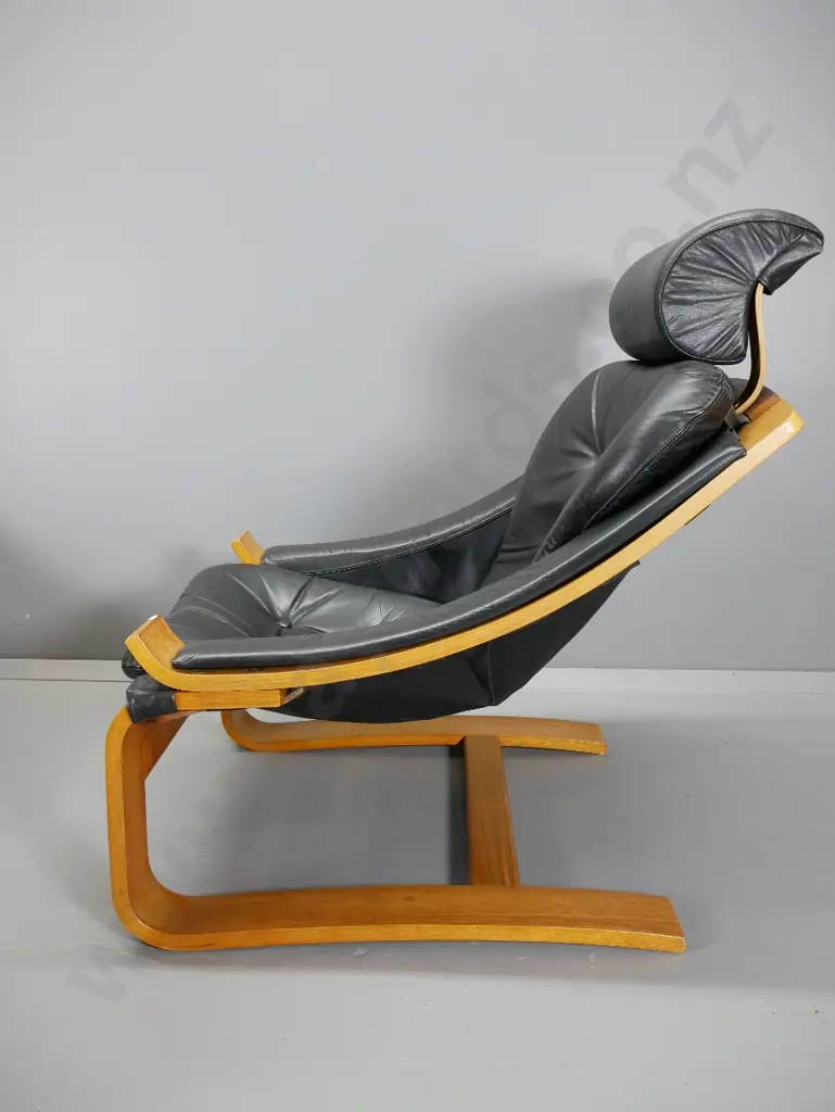 pair of mid-century Danish Deluxe Melbourne laminated frame black leather lounge chairs w/ foot-stools H920 W740 D900 Image 1++