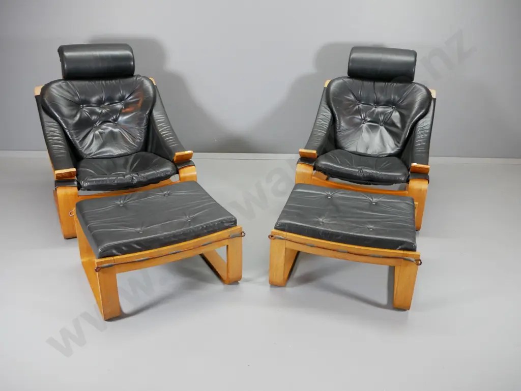 pair of mid-century Danish Deluxe Melbourne laminated frame black leather lounge chairs w/ foot-stools H920 W740 D900 Image 1++
