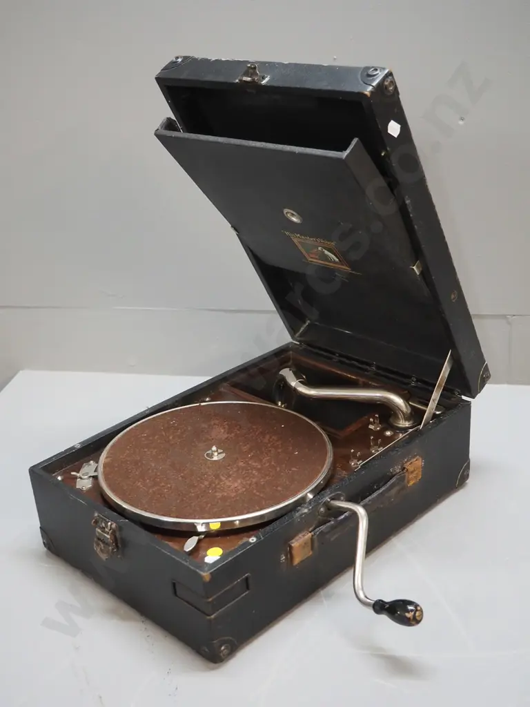 HMV wind-up portable gramophone - working. Corrosion to handle anchors, wear to case Image 1++