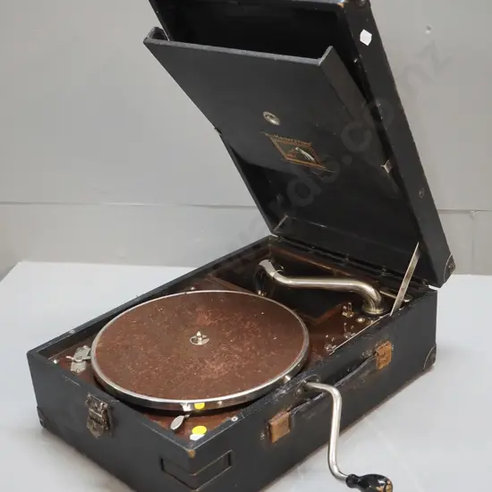 HMV wind-up portable gramophone - working. Corrosion to handle anchors, wear to case