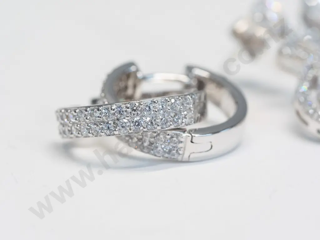 2 pairs of silver cz earrings both stamped 925 Image 1++