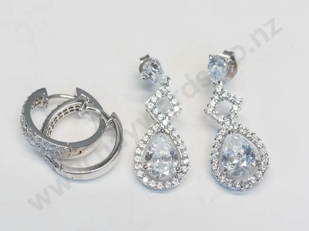 2 pairs of silver cz earrings both stamped 925 Image 1++