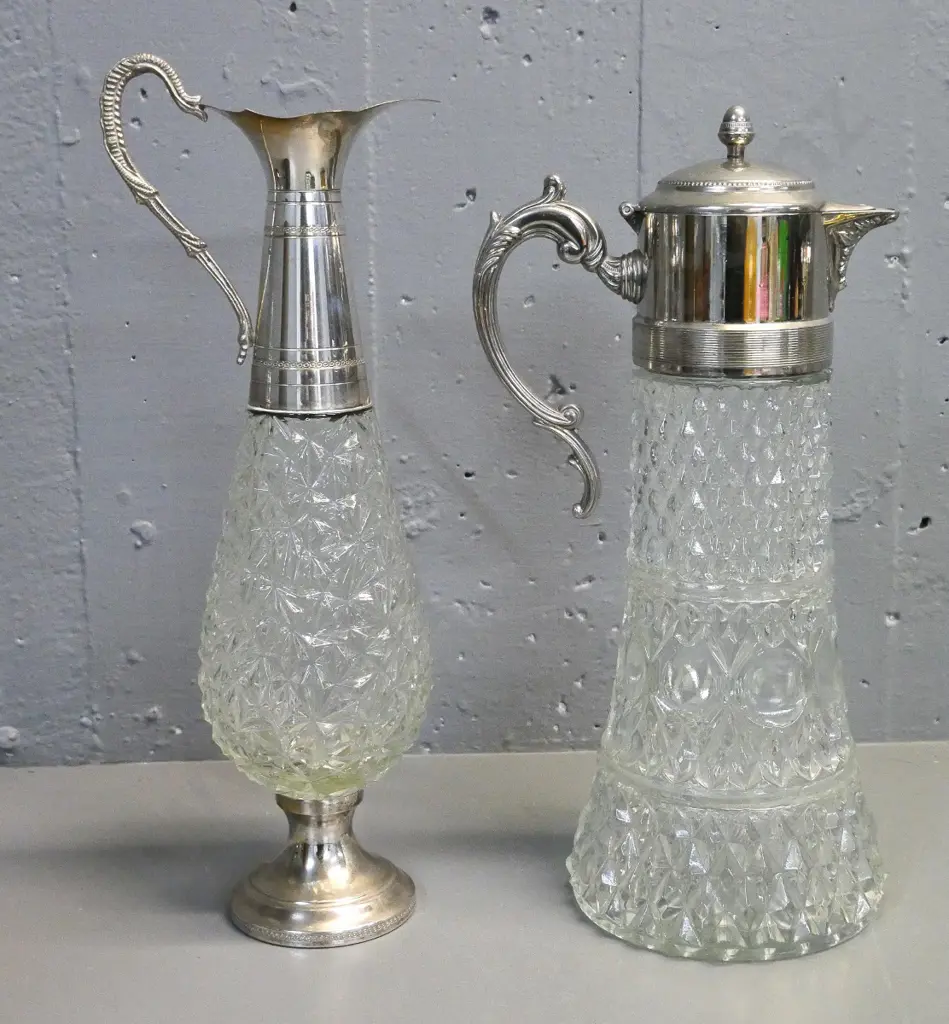 2 depression glass and silver plated claret jugs - one with hinged lid H-380, other is missing its stopper Image 1++