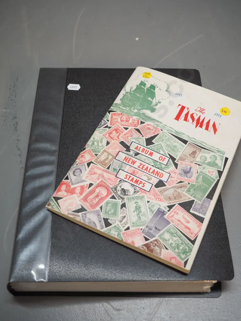 2 stamp albums - one includes early New Zealand, larger folder is mainly Australian Image 1++