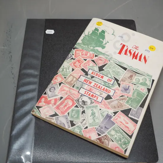 2 stamp albums - one includes early New Zealand, larger folder is mainly Australian