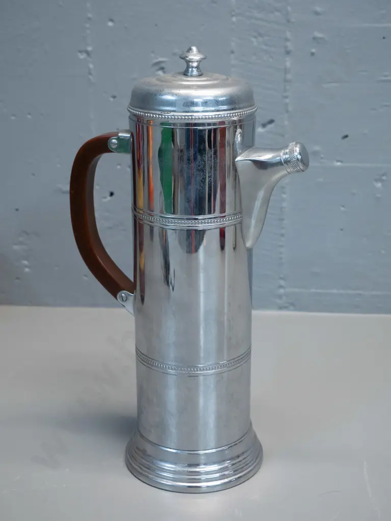 tall plated coffee pot with bakelite handle, spout has stopper jammed. Marked Kromecraft - Farber Bros New York H320 Image 1++