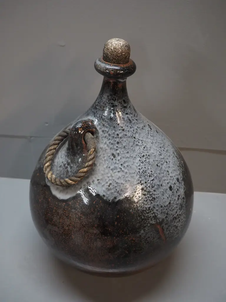 studio pottery large flask with cork stopper, rope handle, "LE" maker's mark on base H380 D270 Image 1++