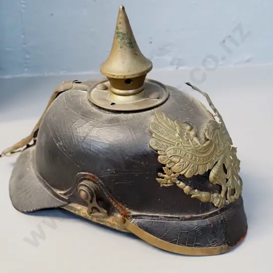 WWI era German "Pickelhaube" leather and brass helmet - very small size, has wear and some damage
