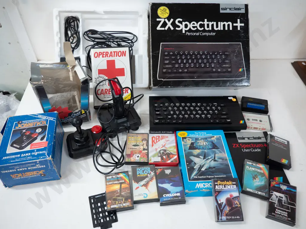 Sinclair ZX Spectrum+ computer with 2 joystick controllers and numerous game cassettes - untested Image 1++