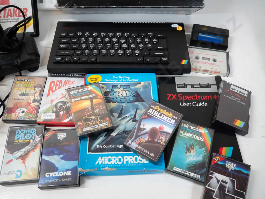 Sinclair ZX Spectrum+ computer with 2 joystick controllers and numerous game cassettes - untested Image 1++