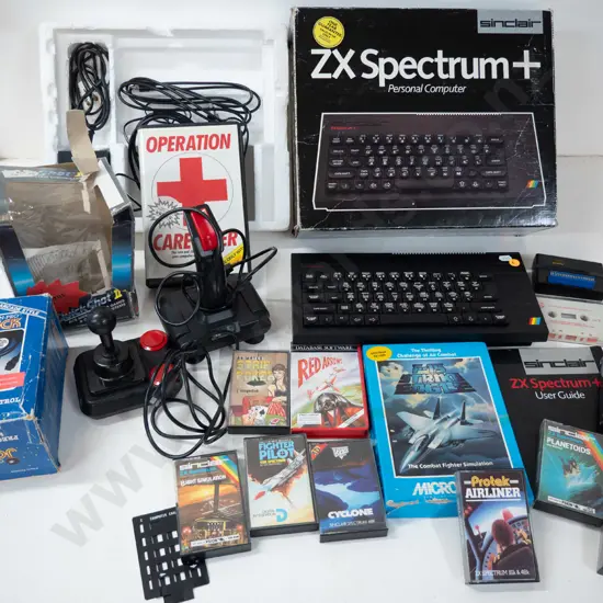 Sinclair ZX Spectrum+ computer with 2 joystick controllers and numerous game cassettes - untested