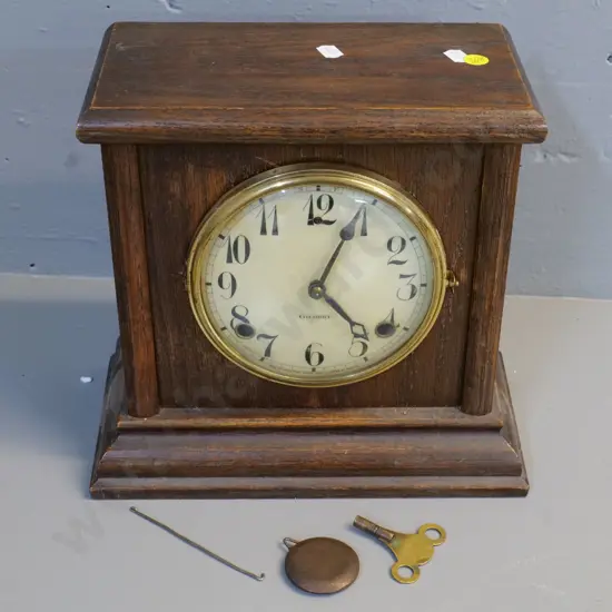 oak-cased mantel clock - with brass bezel, enamel face marked Gilbert  H-260 W-270 D-140
