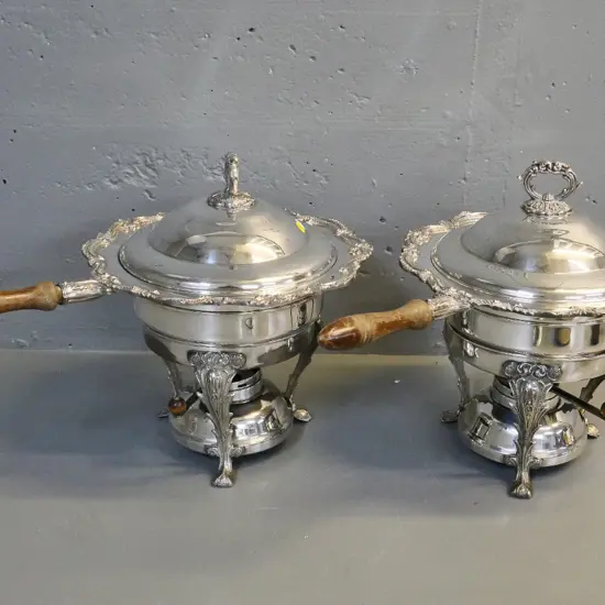 2 silver plated lidded serving dishes with wooden handles on spirit burner bases - polish loss to wood H340 W500