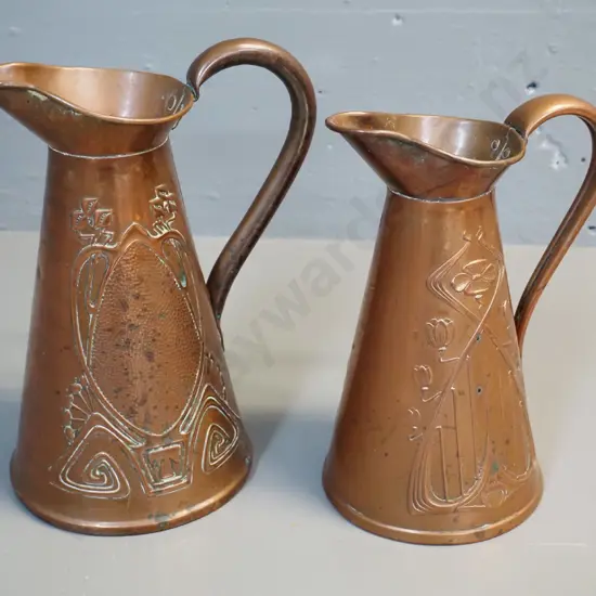 two copper jugs with art nouveau style raised patterns - taller is H-220