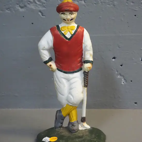 painted cast metal golfer doorstop H-270