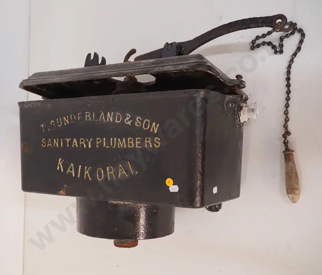 cast iron wall mount toilet cistern, marked T. Sunderland & Son Kaikorai, with timber pull - some corrosion H480 W570 Image 1++
