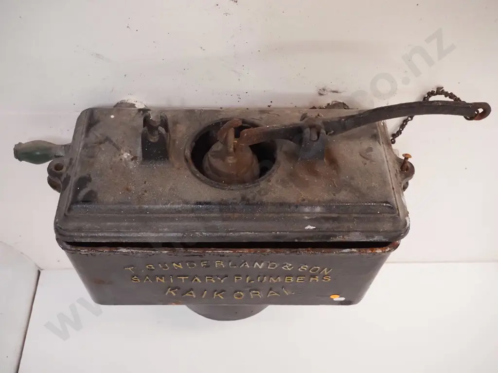 cast iron wall mount toilet cistern, marked T. Sunderland & Son Kaikorai, with timber pull - some corrosion H480 W570 Image 1++