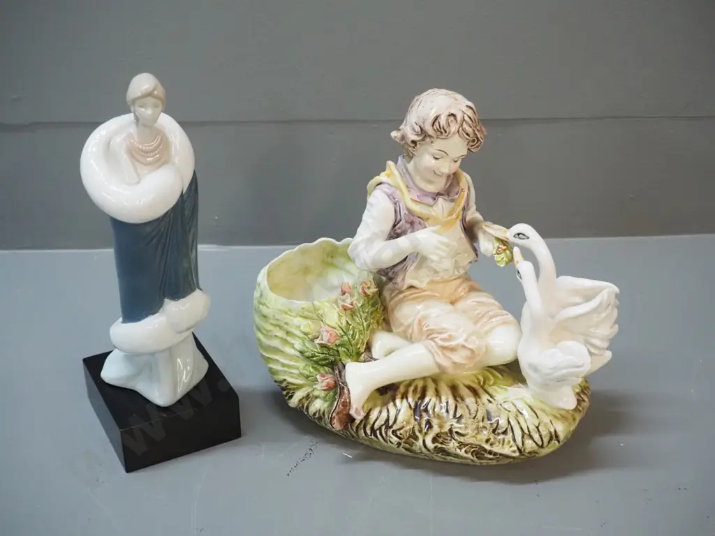 2 figurines - boy feeding geese , no maker's mark, and a woman figure marked Compliments of Marco Giner 1987, H-230 Image 1++