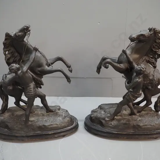 pair of cast metal rearing horse figures on painted wooden bases - damage to leg of one, unknown signature H-440 L-350