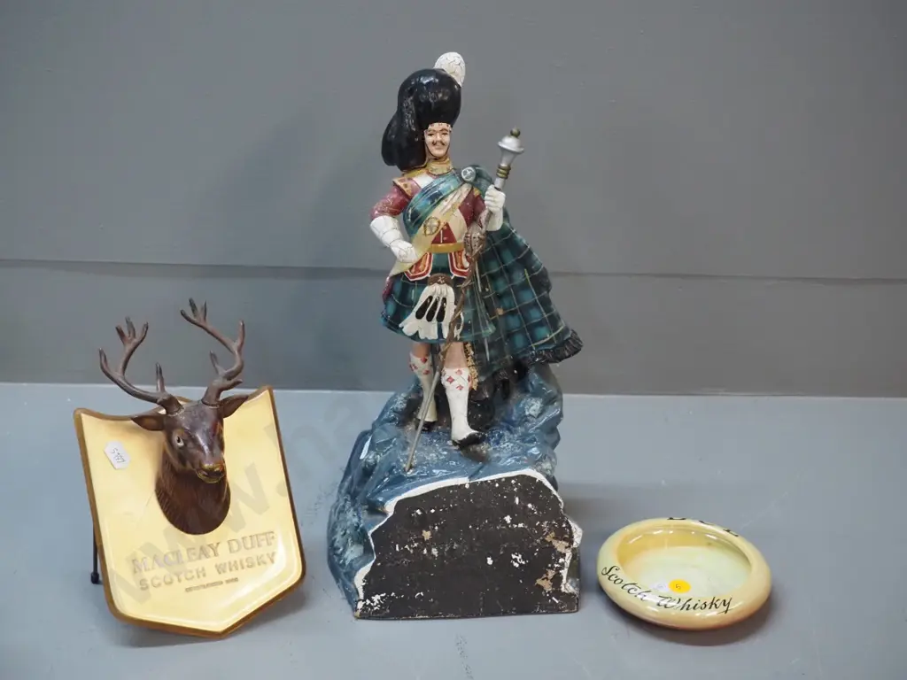 whisky items - Dewar's piper figure with finish wear H-350, Maclay-Duff stag's head plaque, DCL ashtray Image 1++