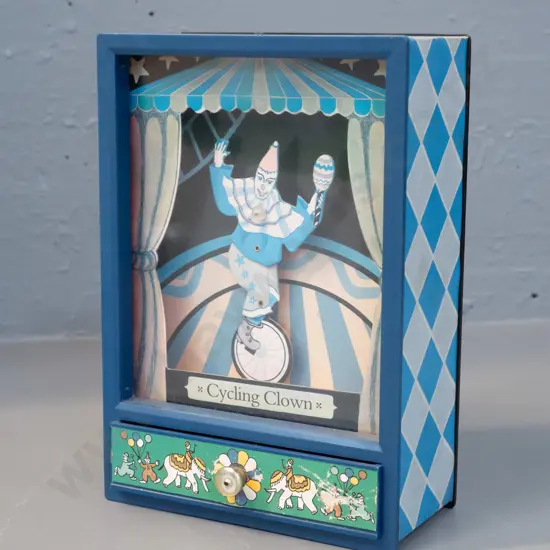 plastic cased wind-up music box - cycling clown moves when drawer is pulled out H-190 W-130 D-65