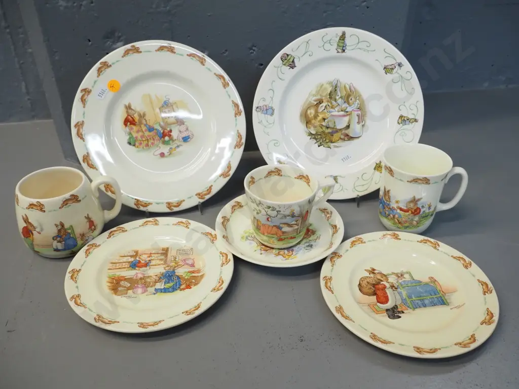 assorted Royal Doulton Bunnykins items - 3 plates, 2 mugs, cup & saucer - and a Wedgwood Beatrix Potter plate Image 1++