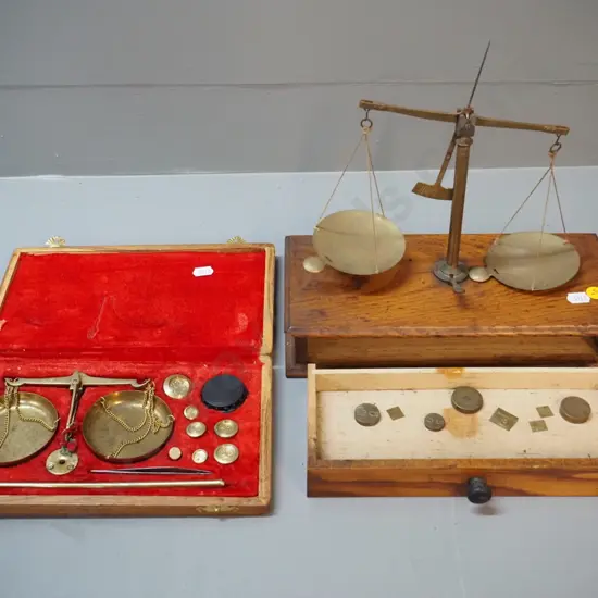 2 sets of gold scales, both needing attention - red-lined set has damage to support, other needs tightening etc.