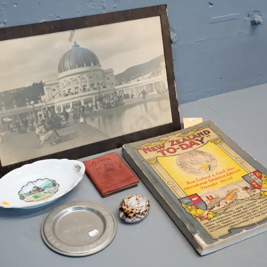 assorted souvenir items from 1925-26 Dunedin Exhibition including photo, large book, dish, etc. plus engraved shell