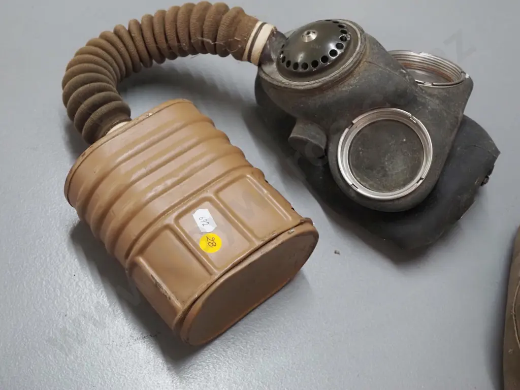 vintage gas mask in musty canvas bag Image 1++